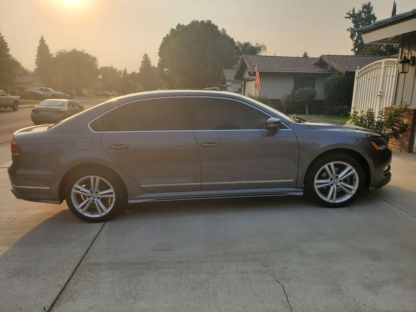 Grey VW Passat at sunset with tinted windows